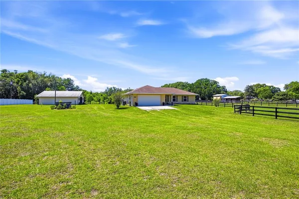 a view of a house with a big yard