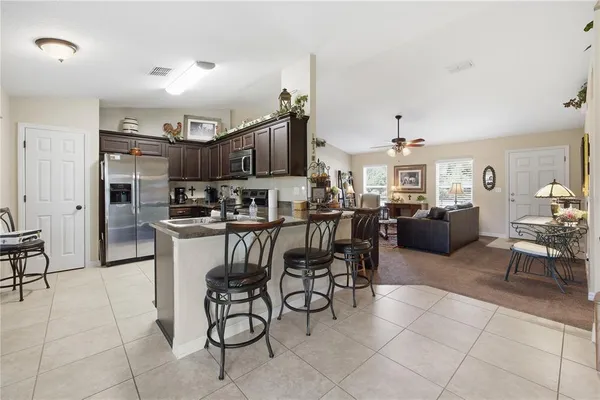 a living room with lots of furniture and appliances