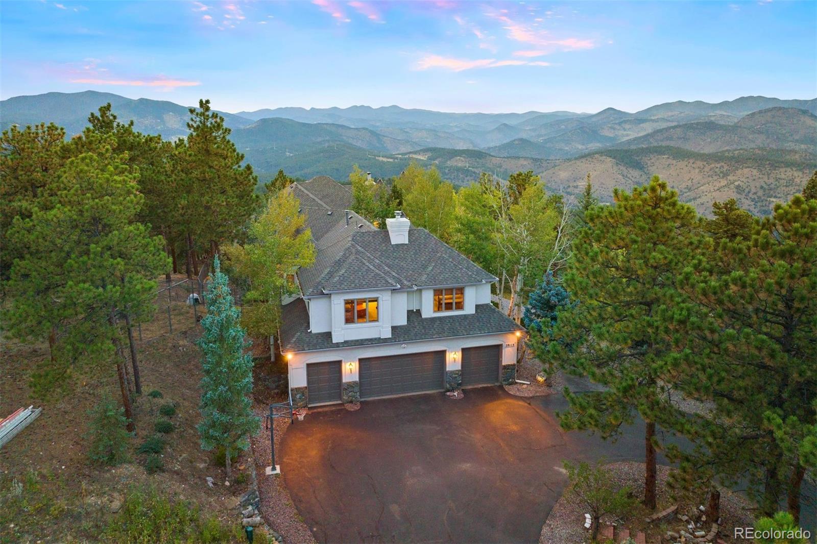 29115 Summit Ranch Drive Golden, CO 80401 - Photo 16 of 50 a view of a house with a lake view