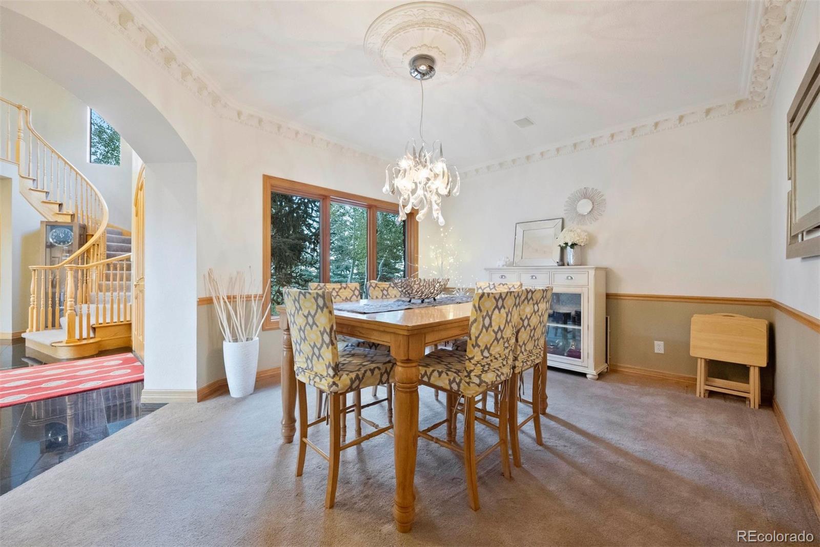 29115 Summit Ranch Drive Golden, CO 80401 - Photo 20 of 50 a dining room with furniture and window