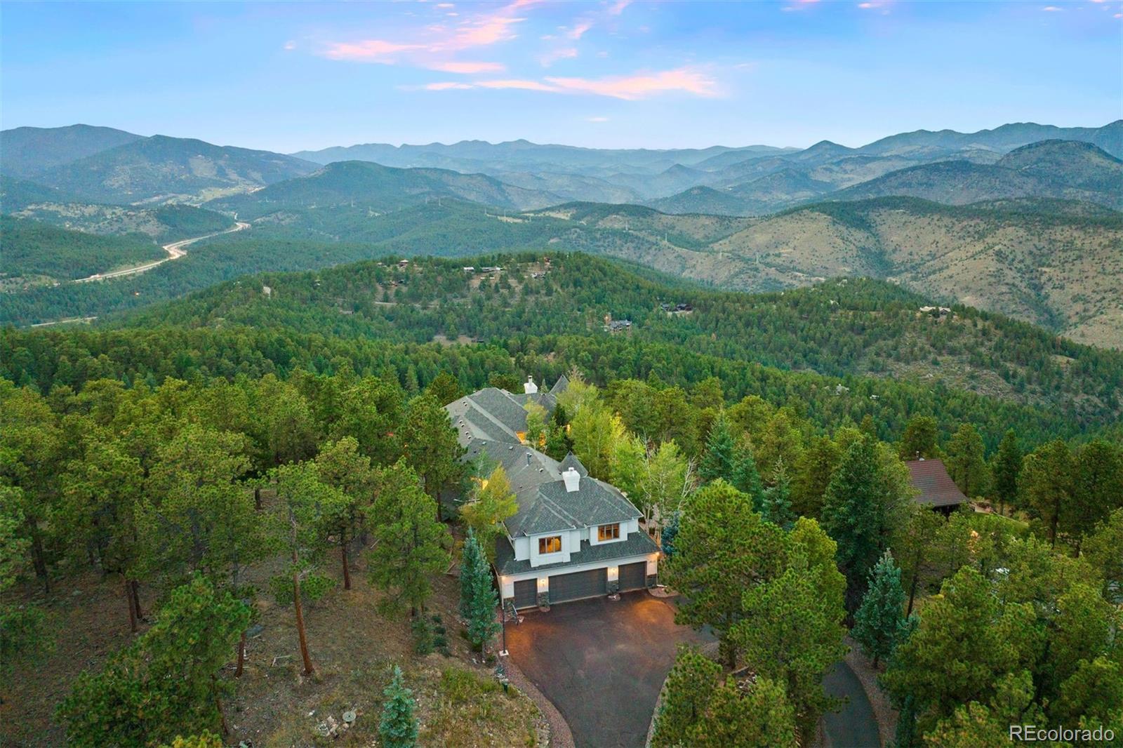 29115 Summit Ranch Drive Golden, CO 80401 - Photo 34 of 50 an aerial view of a house with a yard