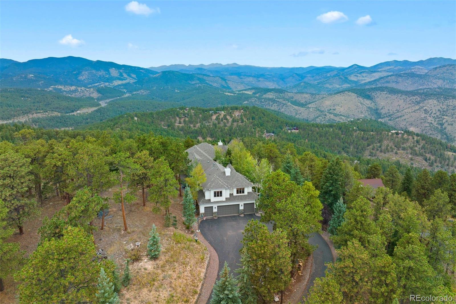 29115 Summit Ranch Drive Golden, CO 80401 - Photo 35 of 50 a view of a mountain from a yard