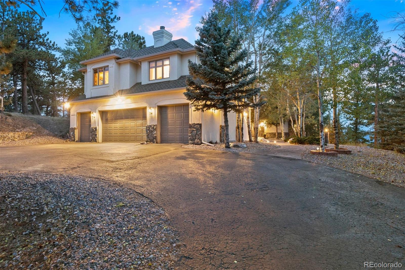 29115 Summit Ranch Drive Golden, CO 80401 - Photo 40 of 50 a view of a house with a street