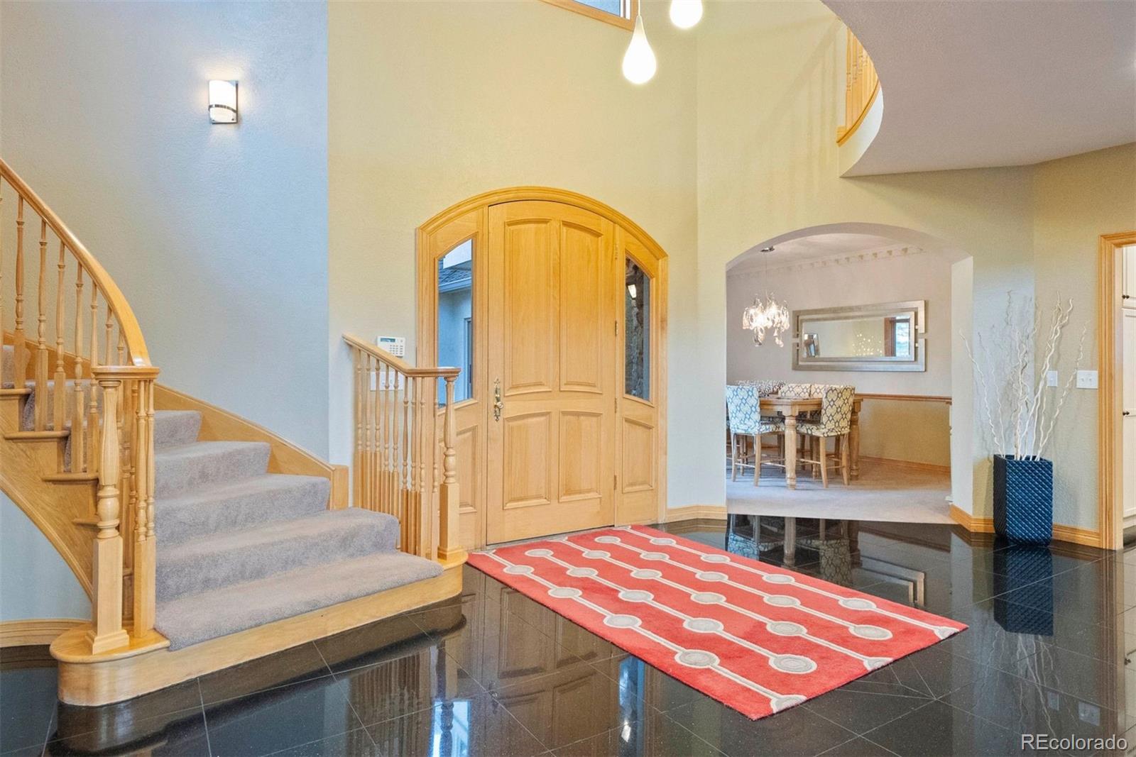29115 Summit Ranch Drive Golden, CO 80401 - Photo 4 of 50 a view of an entryway with wooden floor and livingroom view