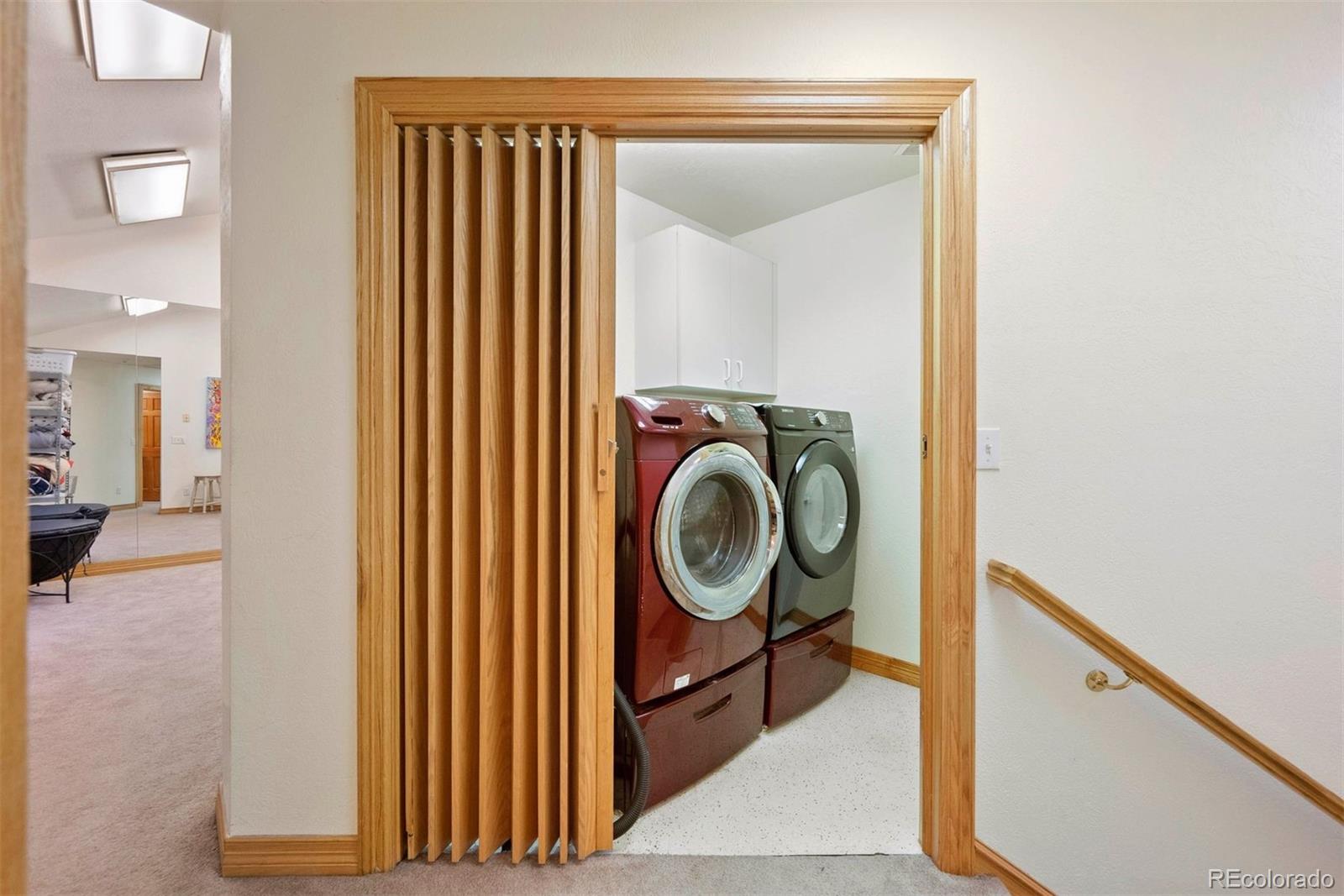 29115 Summit Ranch Drive Golden, CO 80401 - Photo 45 of 50 a view of a hallway with washer and dryer
