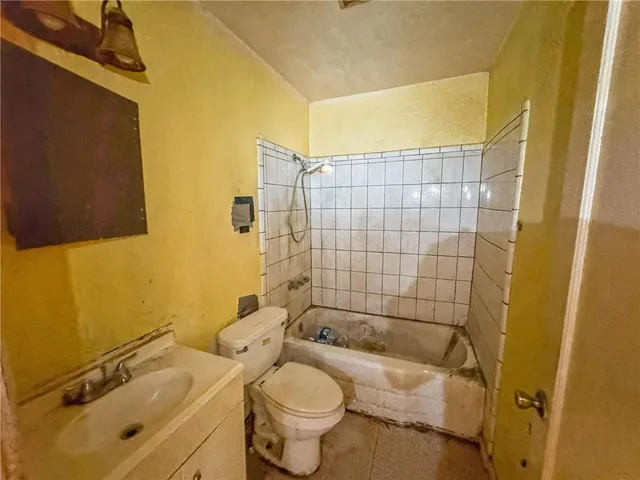 a view of wooden house with a large window