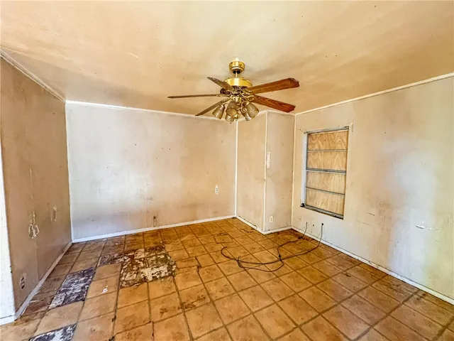 a kitchen with a stove a sink and a refrigerator