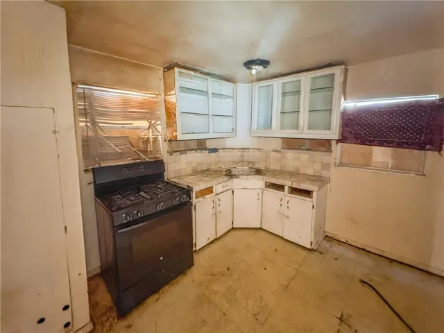 a kitchen with a stove and a sink