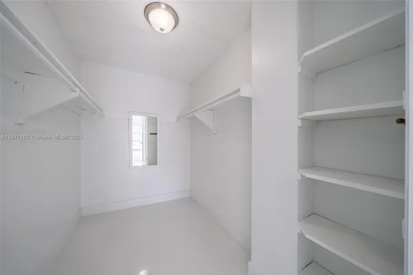 a view of living room with furniture and flat screen tv