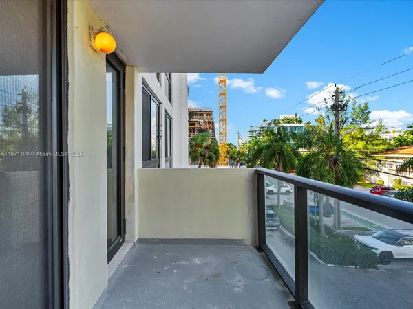 a room with gym equipment and potted plants