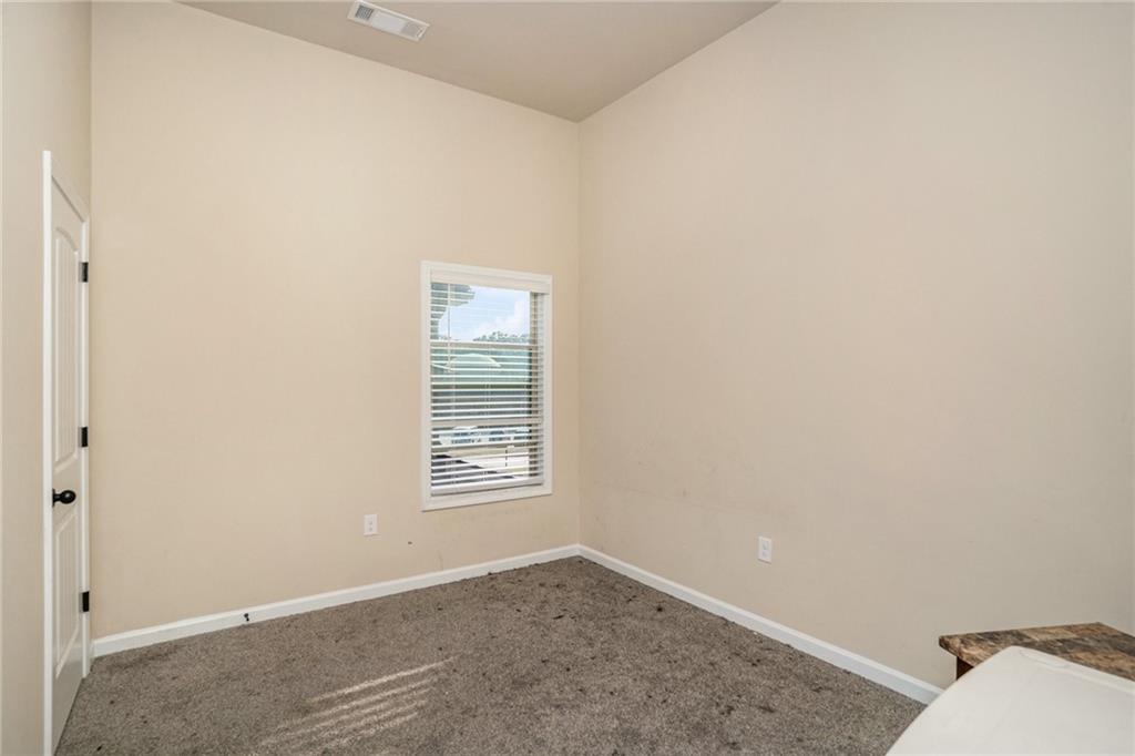 2277 Church Street Hampton, GA 30228 - Photo 21 of 30 an empty room with windows