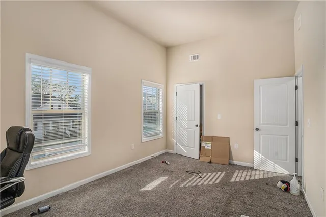 a view of livingroom with furniture and windows