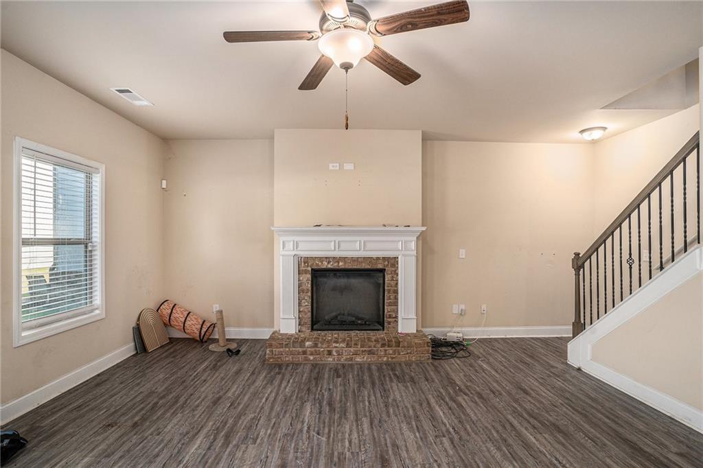 2277 Church Street Hampton, GA 30228 - Photo 8 of 30 a living room with furniture and a fireplace