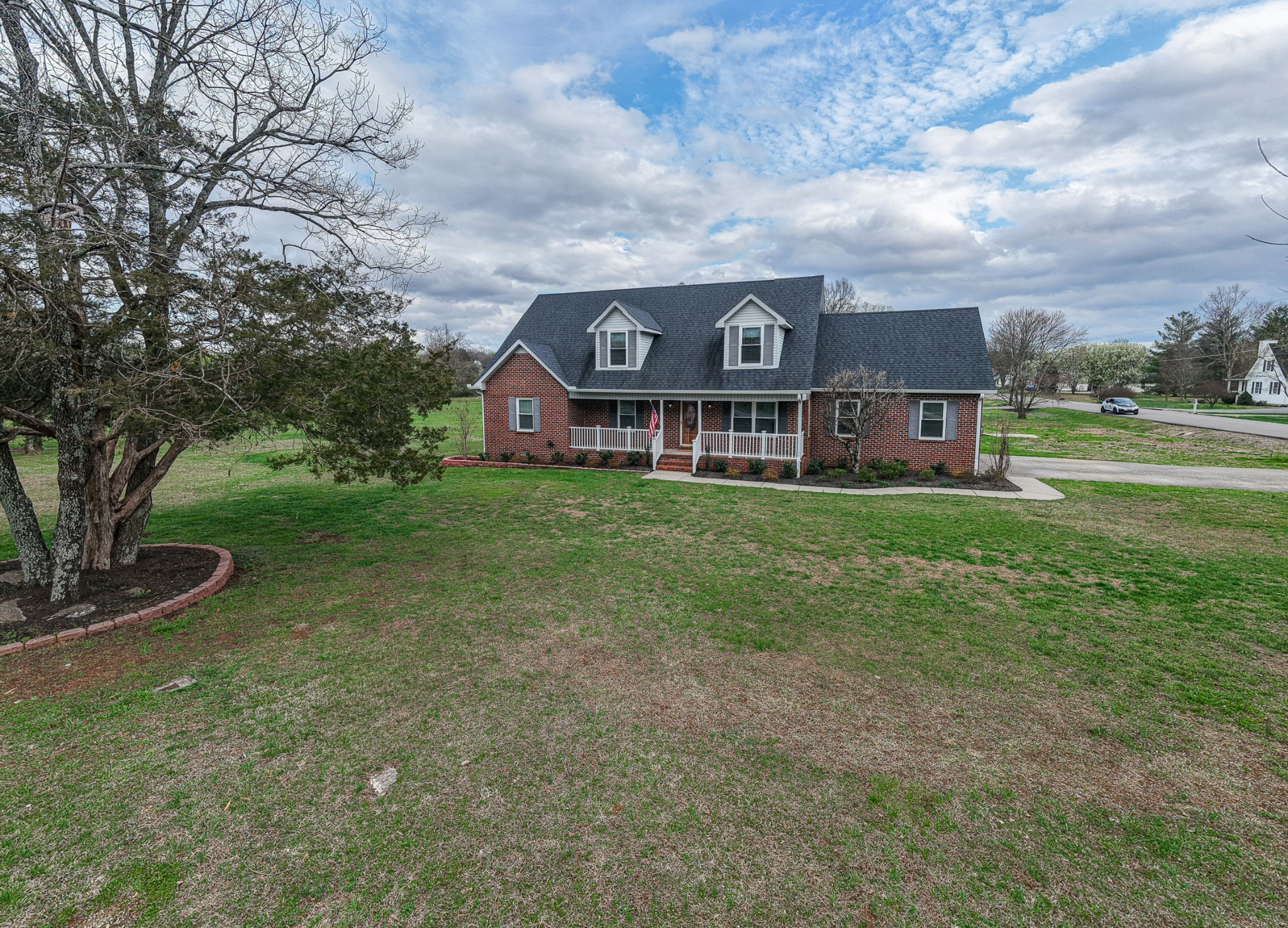 3145 Middleton Drive Rockvale, TN 37153 - Photo 3 of 50 a view of a big house with a big yard and large trees