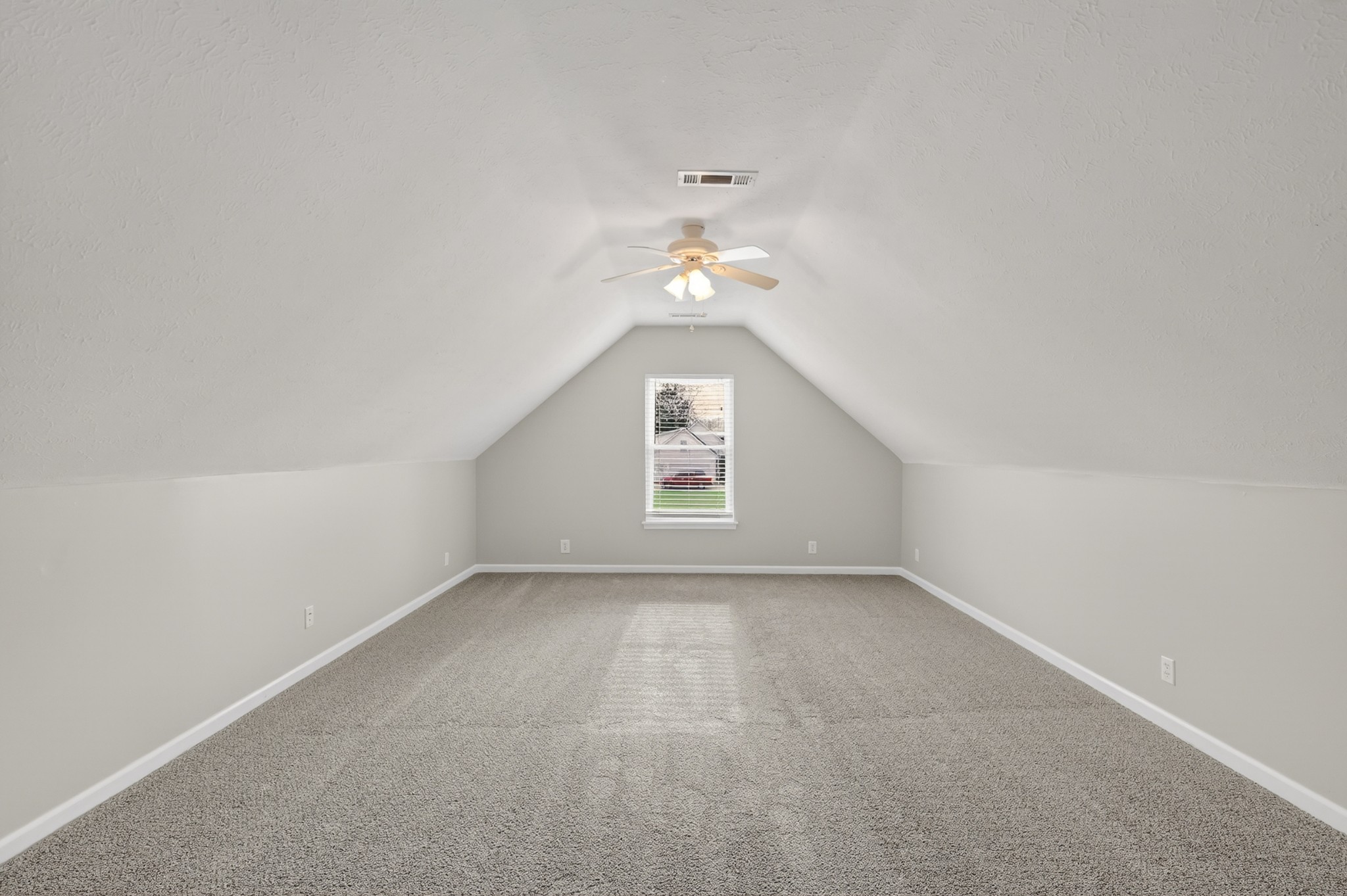 3145 Middleton Drive Rockvale, TN 37153 - Photo 35 of 50 an empty room with a chandelier fan and windows