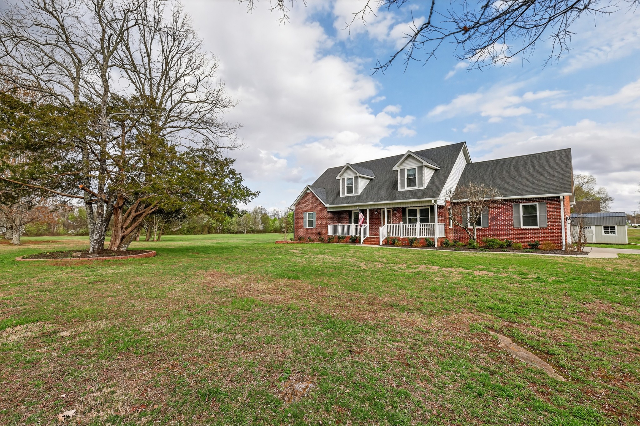 3145 Middleton Drive Rockvale, TN 37153 - Photo 38 of 50 a view of a big yard with large trees and a big yard