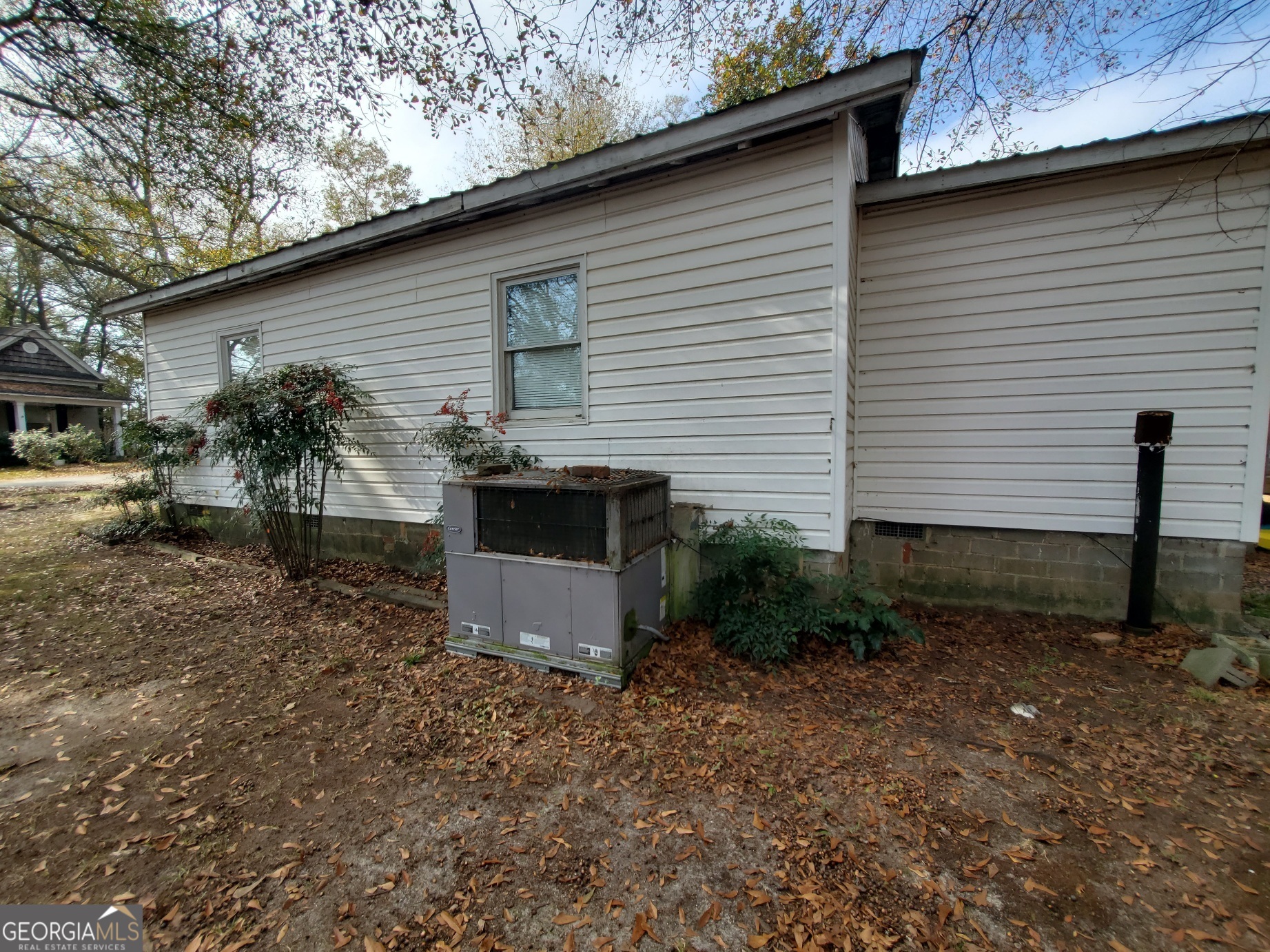 134 Adams Street Lavonia, GA 30553 - Photo 11 of 29 a front view of a house with garden