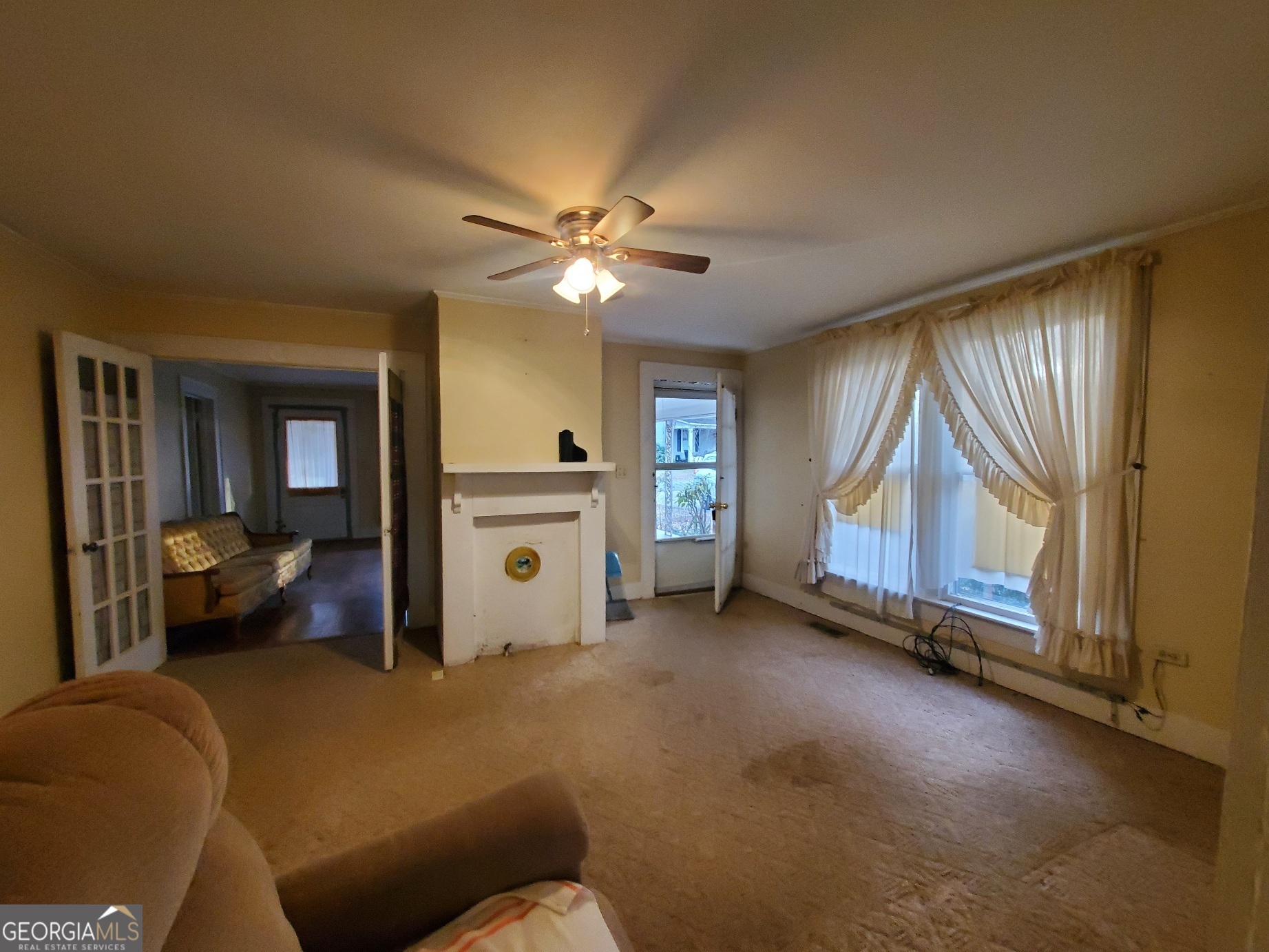 134 Adams Street Lavonia, GA 30553 - Photo 15 of 29 a living room with a couch and a cabinet