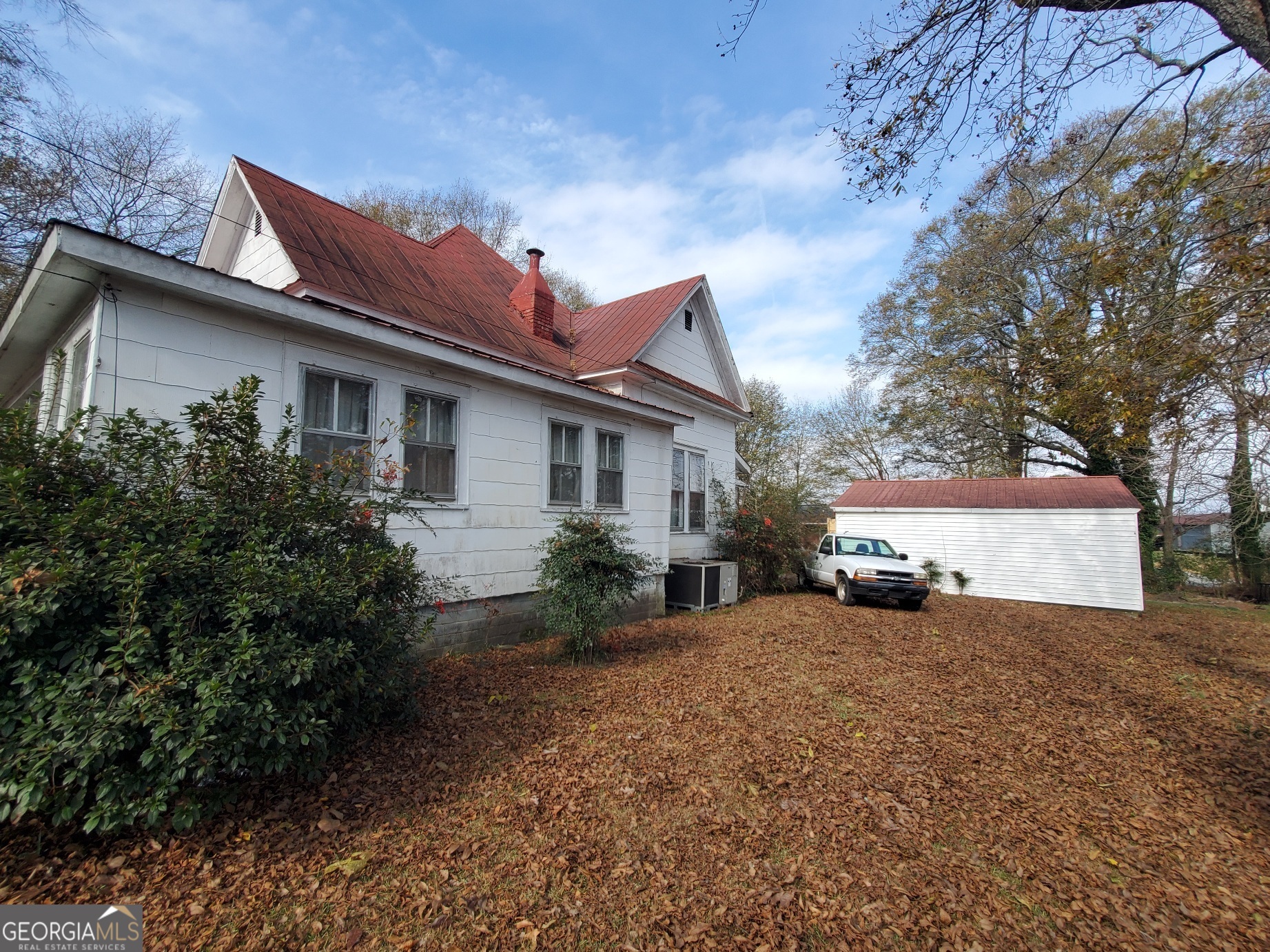 134 Adams Street Lavonia, GA 30553 - Photo 2 of 29 a view of a house with a yard and large tree