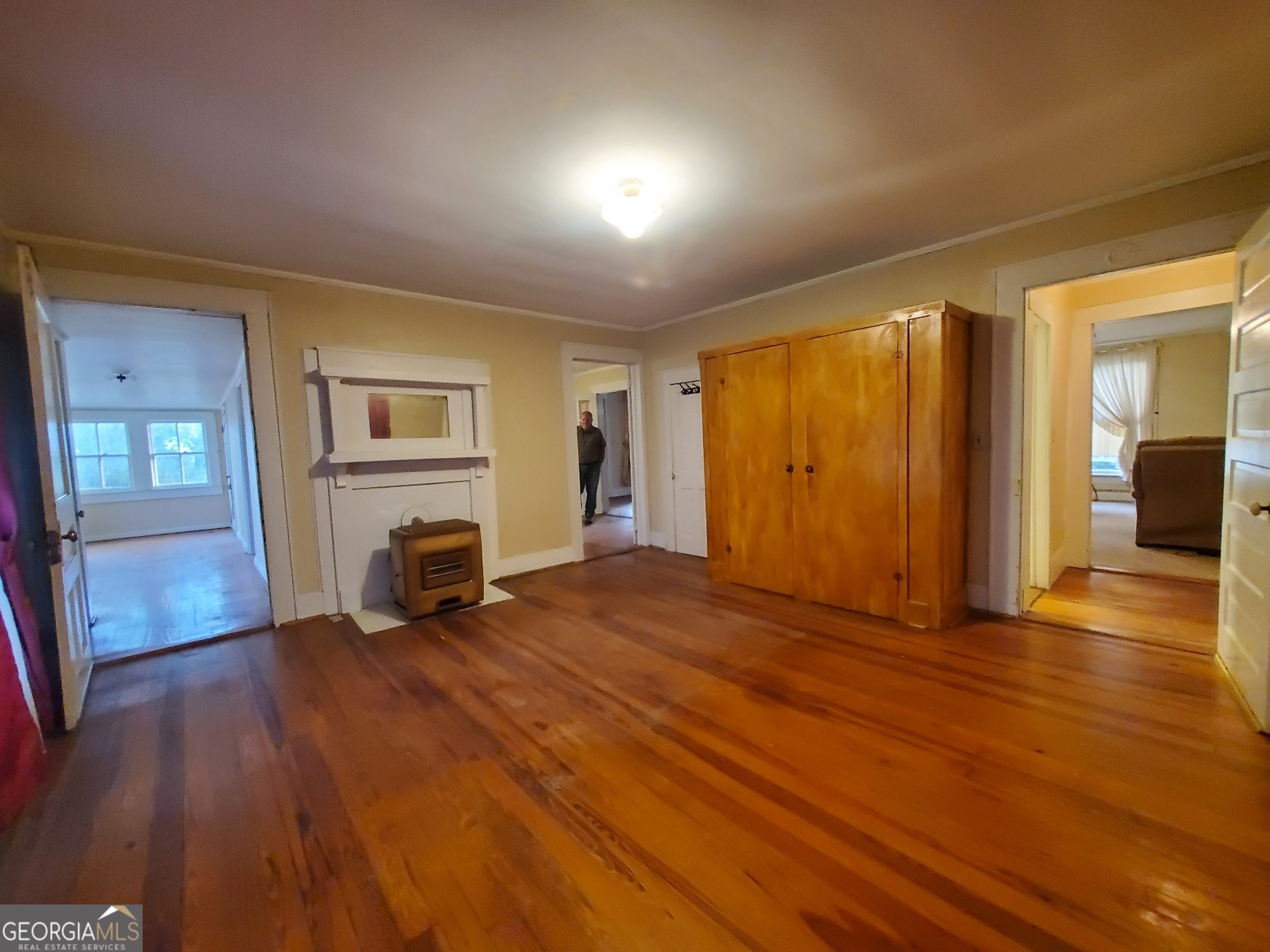 134 Adams Street Lavonia, GA 30553 - Photo 24 of 29 a view of empty room with wooden floor and fireplace
