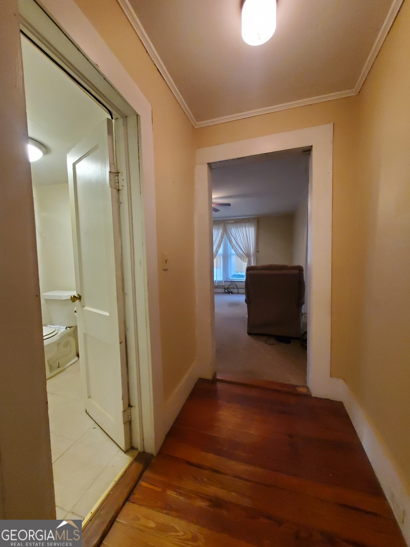 134 Adams Street Lavonia, GA 30553 - Photo 26 of 29 a view of a hallway with wooden floor and closet