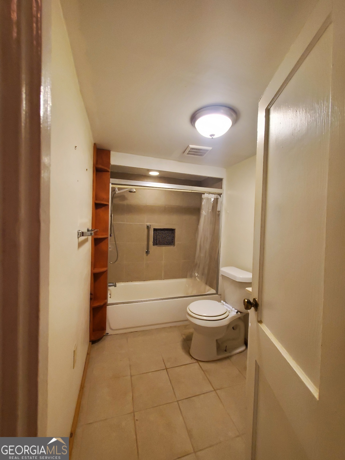 134 Adams Street Lavonia, GA 30553 - Photo 27 of 29 a bathroom with a toilet and a shower