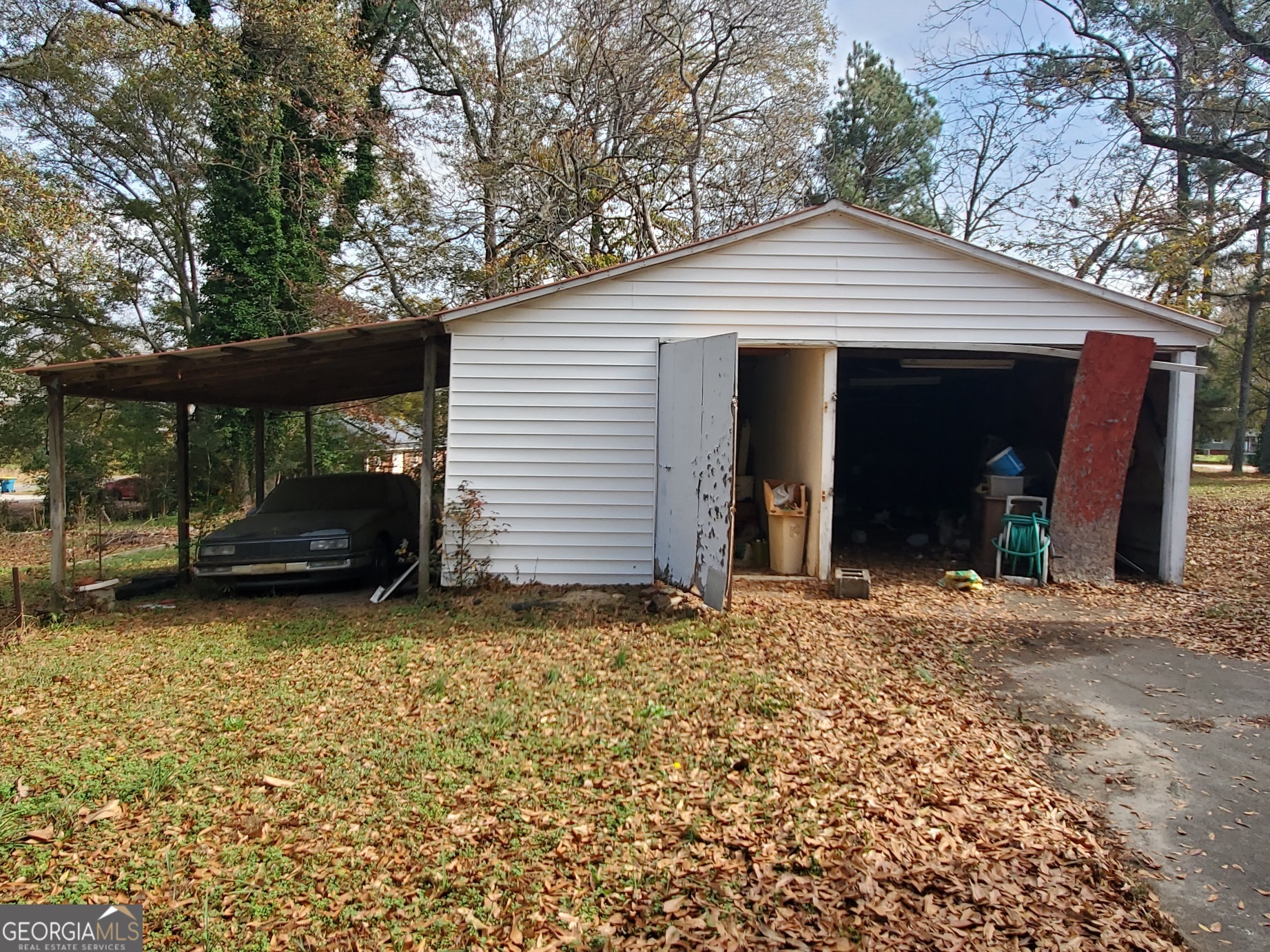 134 Adams Street Lavonia, GA 30553 - Photo 5 of 29 a view of a house with a garage and chair