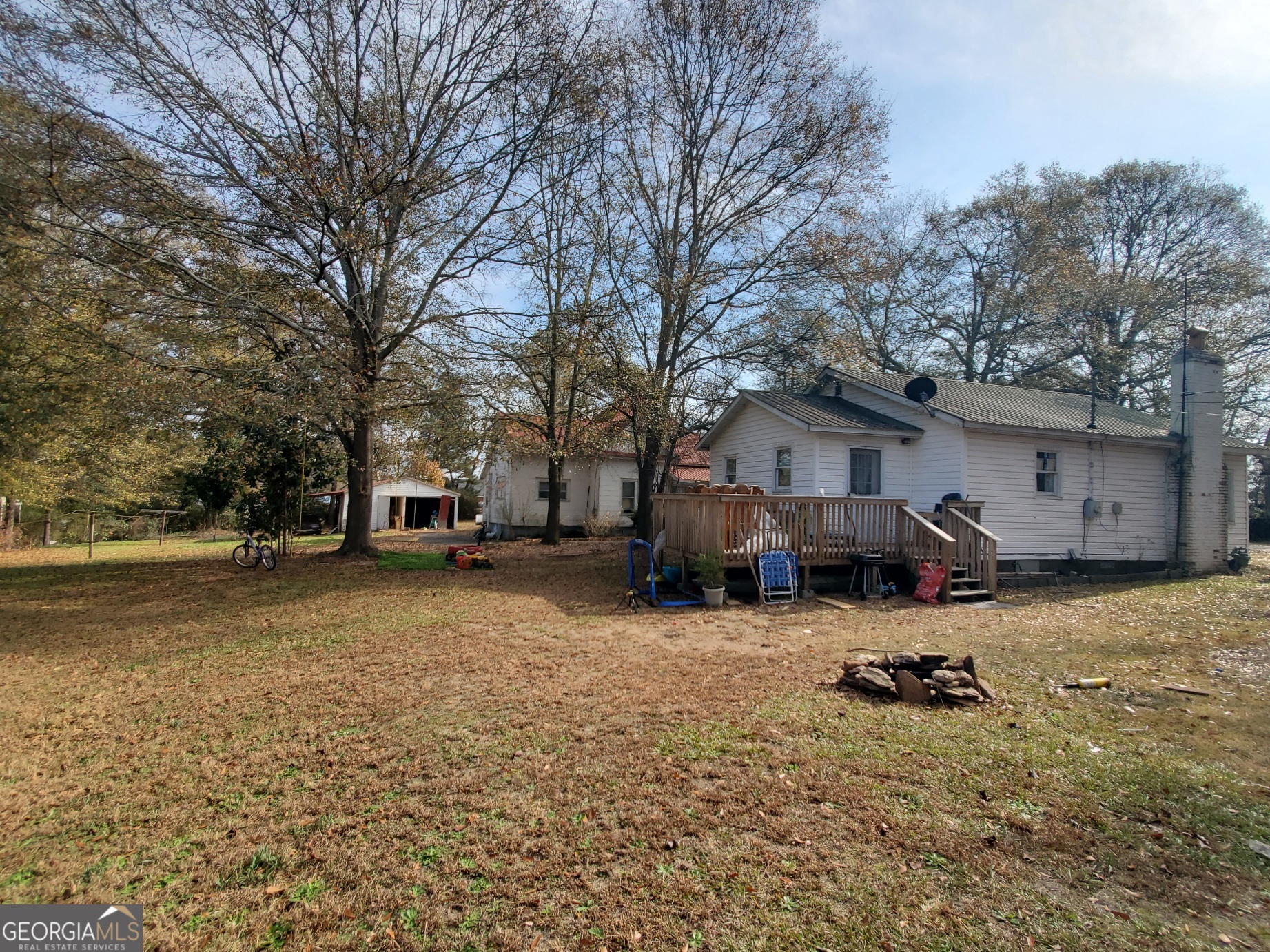 134 Adams Street Lavonia, GA 30553 - Photo 8 of 29 a view of a house with a yard covered in snow
