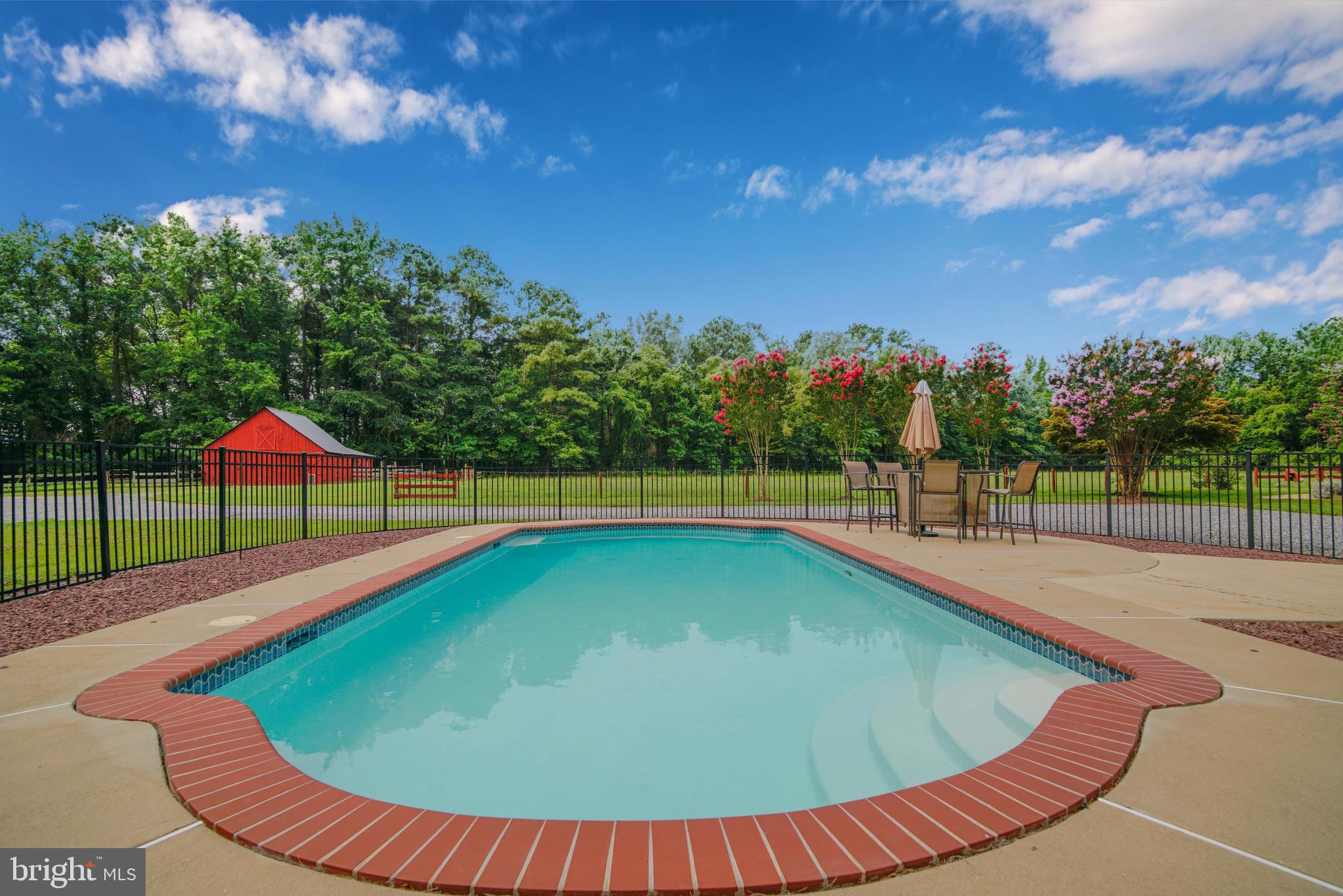 20455 Bowles Road Coltons Point, MD 20626 - Photo 20 of 65 a view of a swimming pool with a patio and a yard