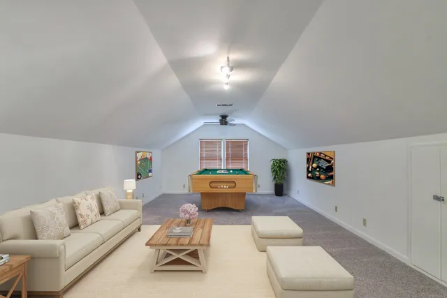a living room with furniture and white walls