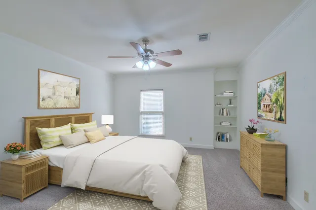 a bedroom with bed and a chandelier
