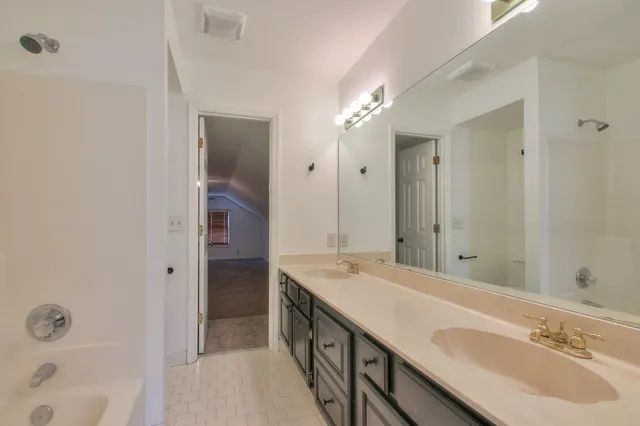 a bath room with a sink and a mirror