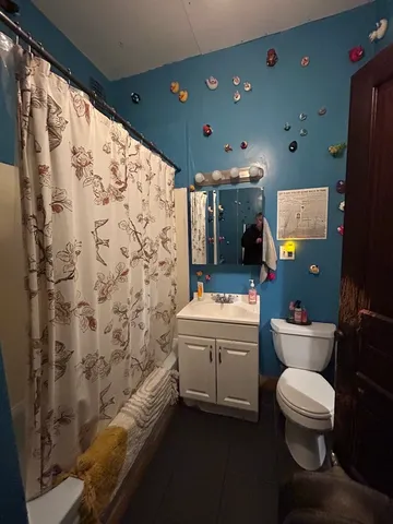 a kitchen with a stove a refrigerator and a table