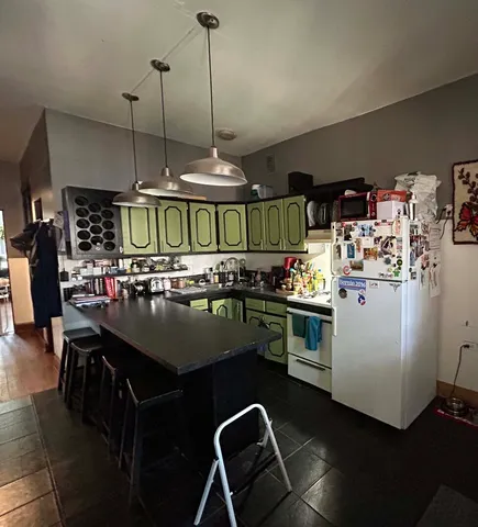 a balcony with table and chairs