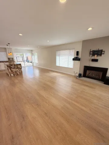 a view of a livingroom with furniture and a window