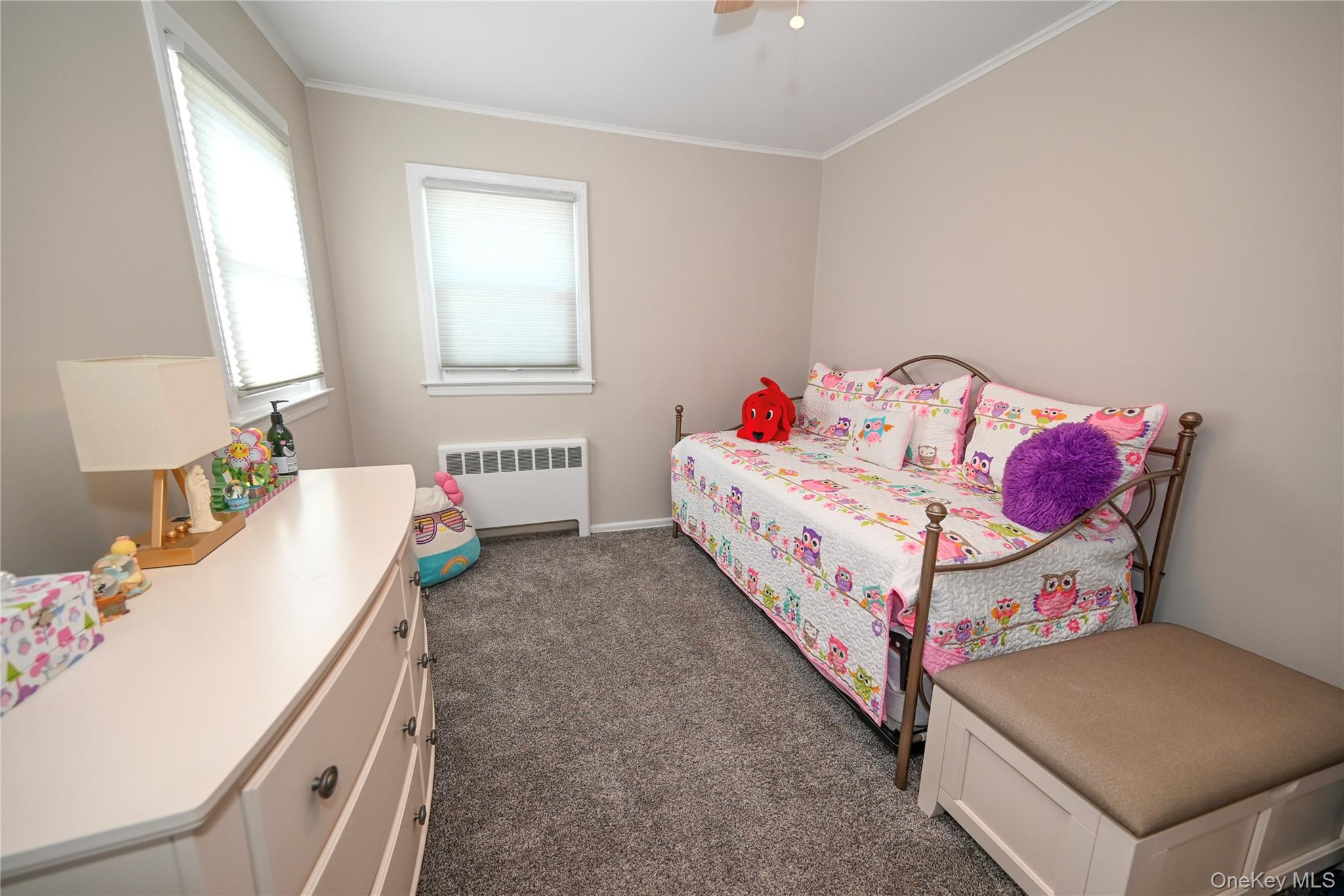 1522 Rica Place Valley Stream, NY 11580 - Photo 13 of 34 a bedroom with a bed and a table