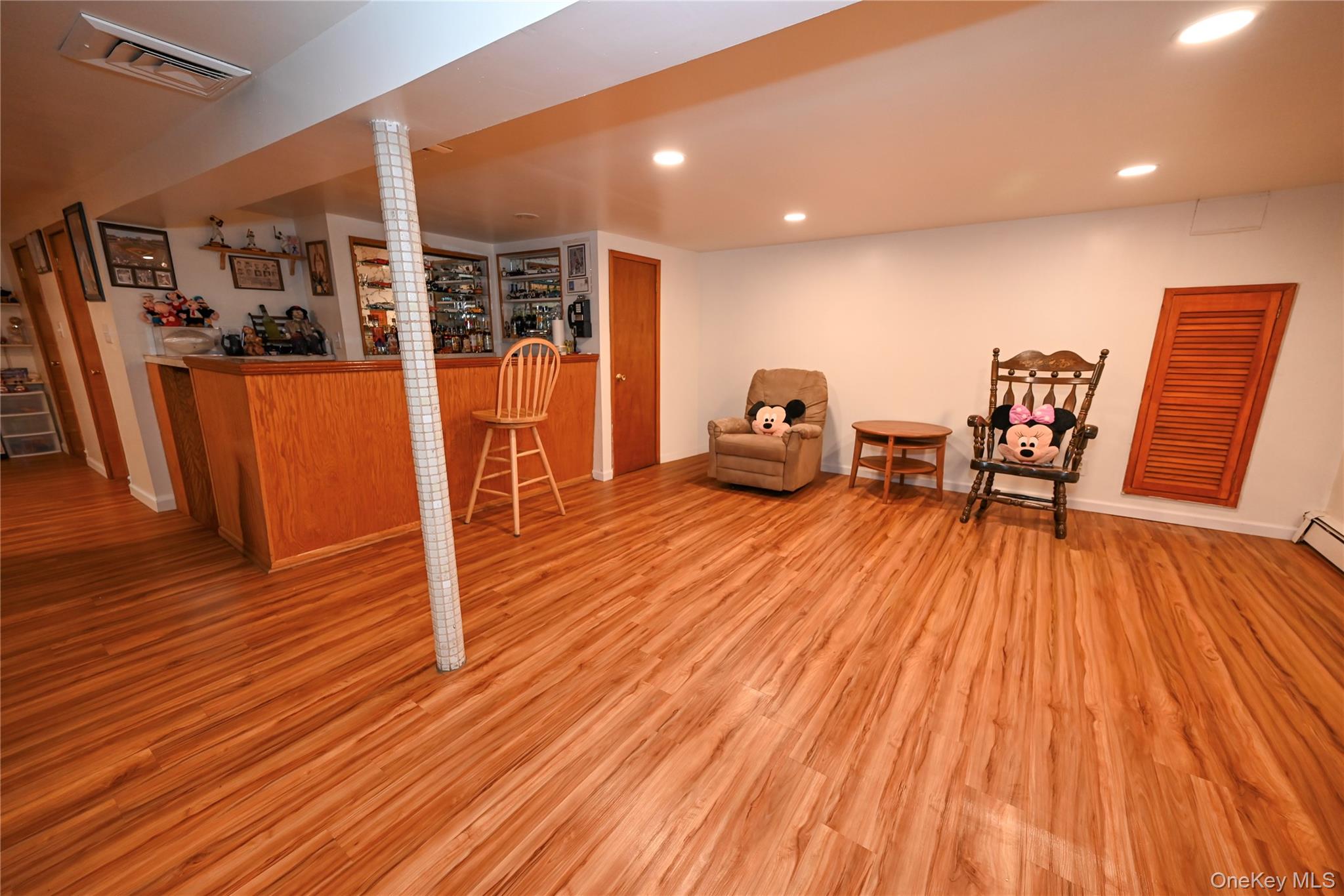 1522 Rica Place Valley Stream, NY 11580 - Photo 17 of 34 a living room with furniture and wooden floor