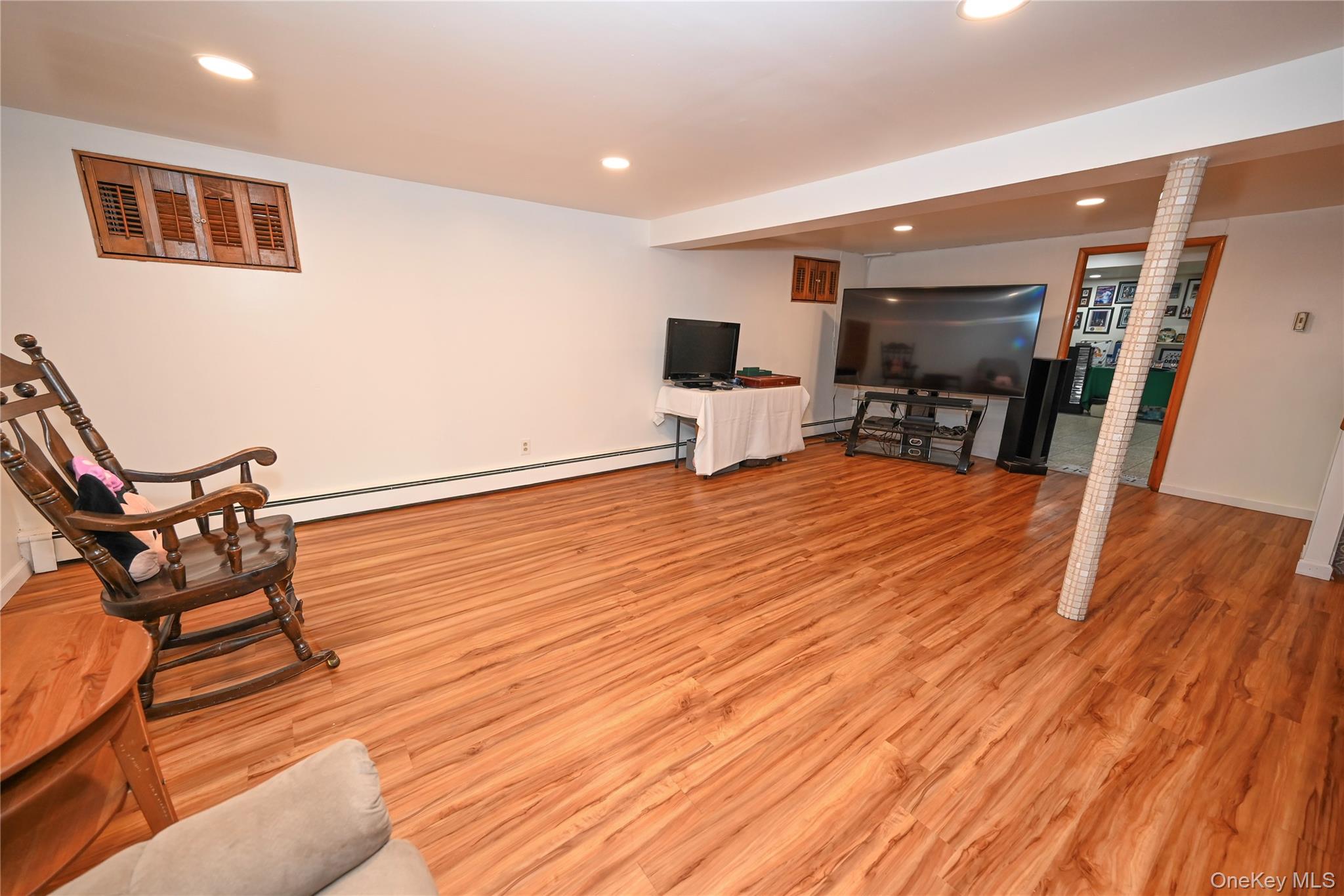 1522 Rica Place Valley Stream, NY 11580 - Photo 18 of 34 a view of a room with furniture and wooden floor