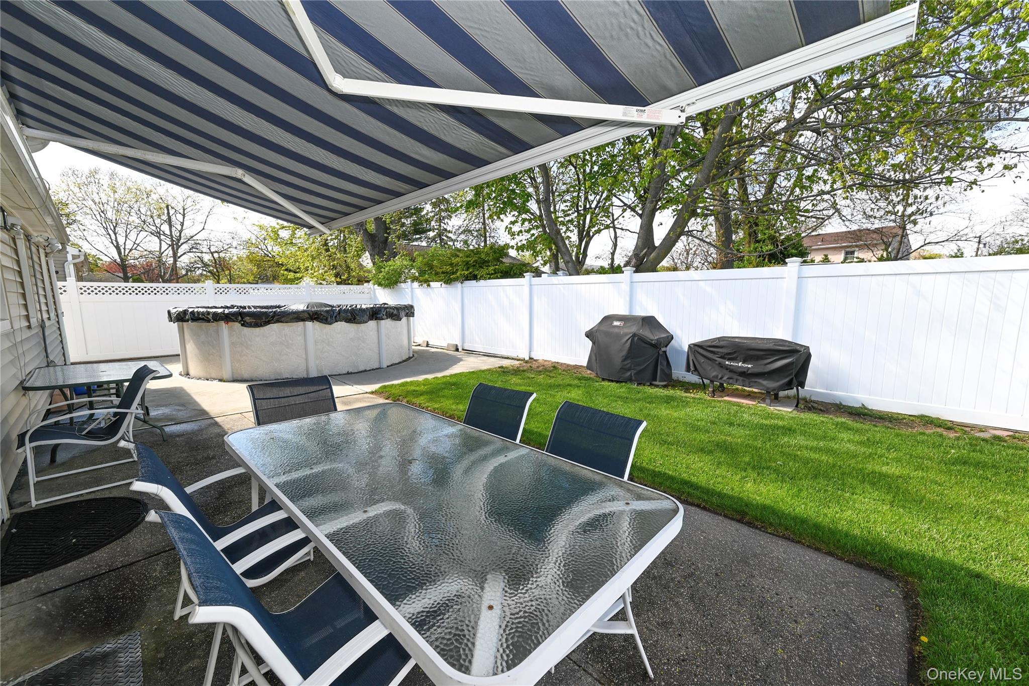 1522 Rica Place Valley Stream, NY 11580 - Photo 24 of 34 a backyard of a house with outdoor seating