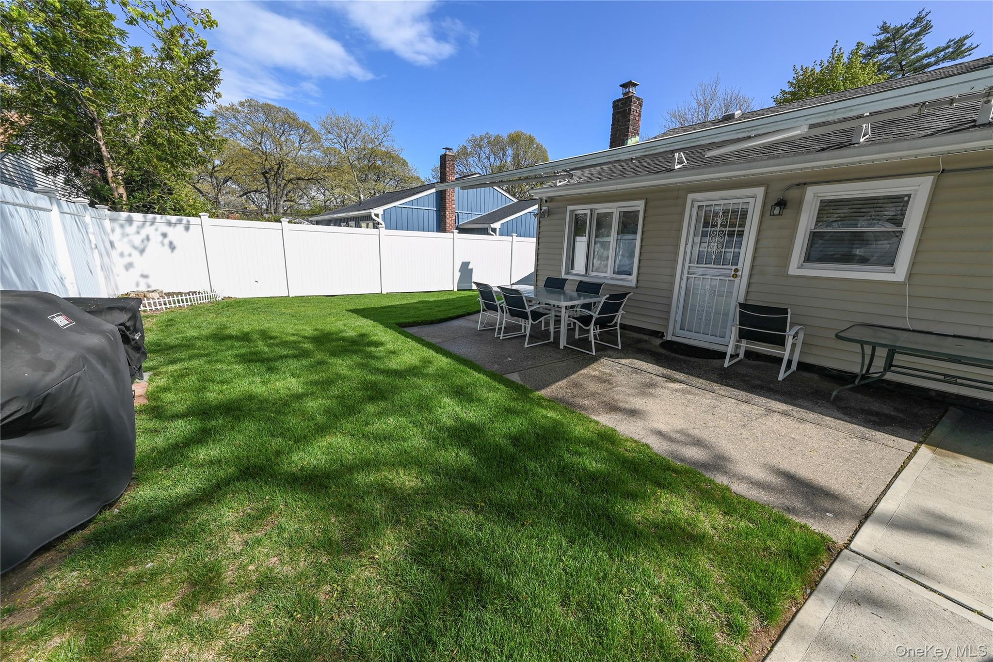 1522 Rica Place Valley Stream, NY 11580 - Photo 26 of 34 a view of a house with backyard sitting area and garden
