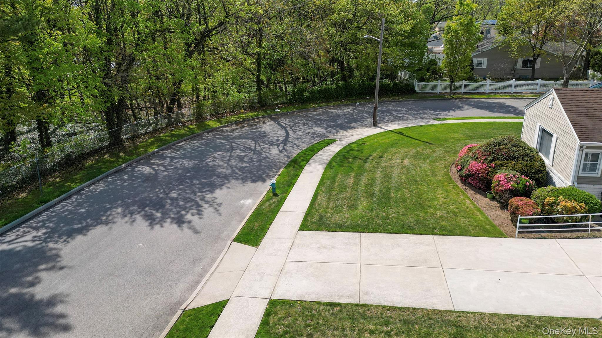 1522 Rica Place Valley Stream, NY 11580 - Photo 30 of 34 a view of a backyard with plants and a patio