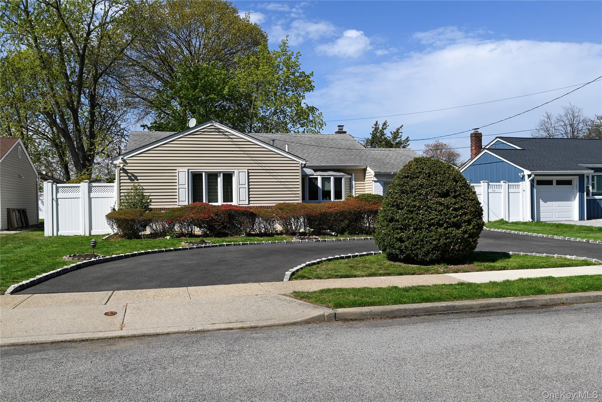 1522 Rica Place Valley Stream, NY 11580 - Photo 33 of 34 a front view of a house with a yard