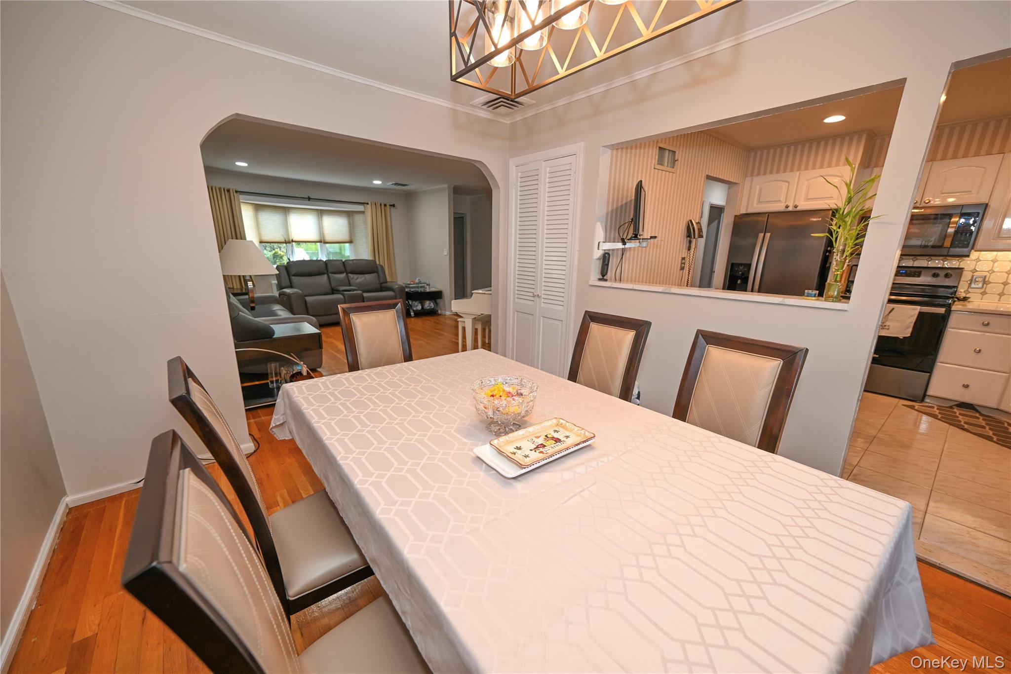 1522 Rica Place Valley Stream, NY 11580 - Photo 5 of 34 a view of a dining room with furniture and wooden floor