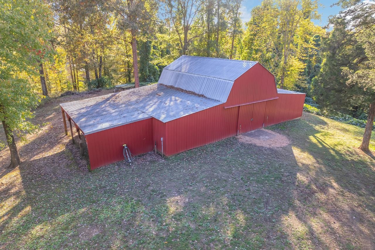 179 Poplar Corner Road Bells, TN 38006 - Photo 2 of 24 a view of a backyard with of trees