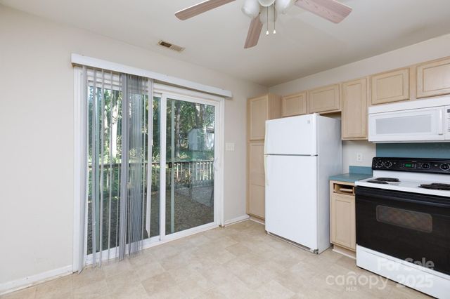 a kitchen with a stove a refrigerator and a refrigerator