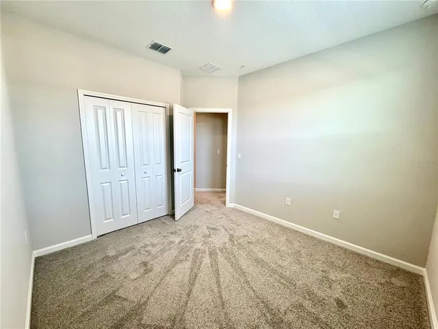 an empty room with a bathroom