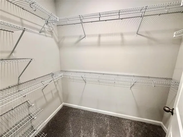 a bathroom with a granite countertop toilet and a shower