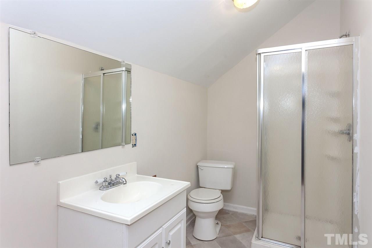 109 Neuse Harbor Drive Raleigh, NC 27610 - Photo 18 of 25 a bathroom with a sink toilet and vanity