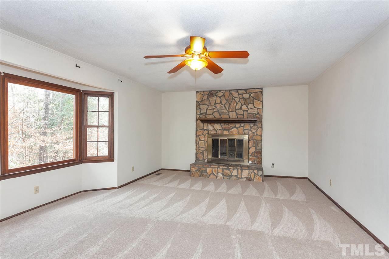 109 Neuse Harbor Drive Raleigh, NC 27610 - Photo 3 of 25 a view of an empty room with window and chandelier fan