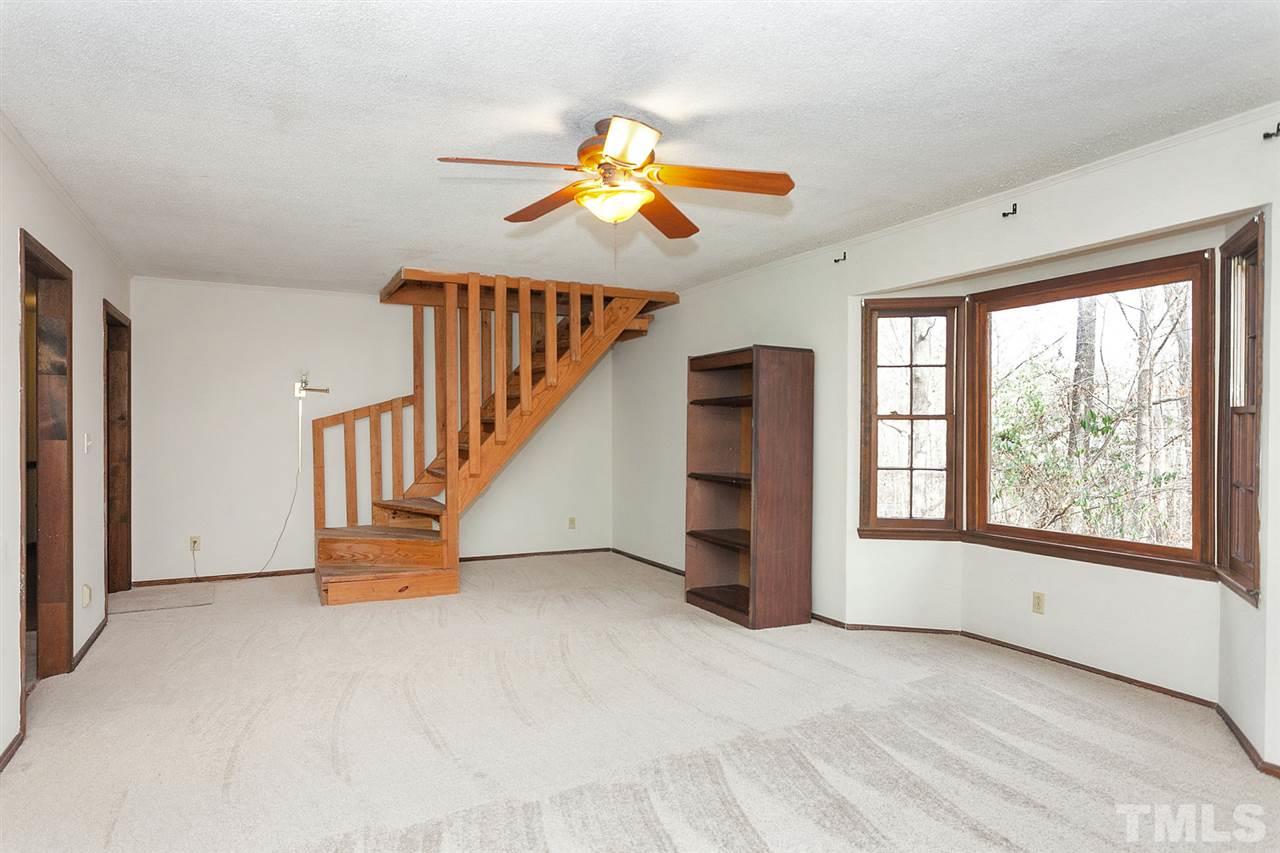 109 Neuse Harbor Drive Raleigh, NC 27610 - Photo 4 of 25 a view of empty room with wooden floor and fan